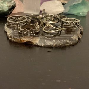 11 rings, all silver. they all have designs on them, no sign of wear and tear.